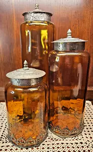 Set of 3 Amber Glass Graduated Size Canisters Tin Lids Boho Style Ornate Bases - Picture 1 of 9