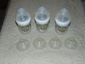 THREE NEW NUK SIMPLY NATURAL 5-OZ BABY BOTTLES 3 STAGE 1 AND 4 STAGE 2 NIPPLES - Picture 1 of 4