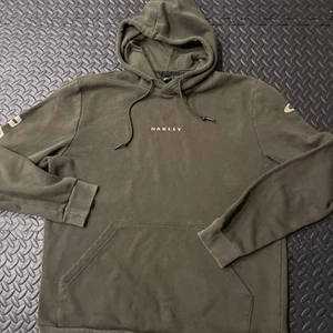 Sudadera con capucha Oakley Bold Bark Pullover polar verde oliva para hombre XLarge - Imagen 1 de 8
