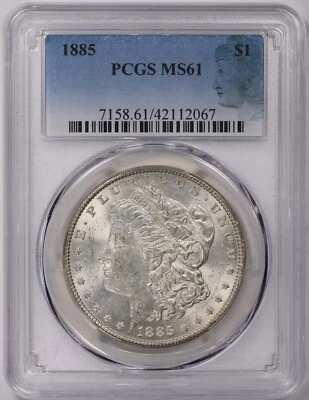 1885   MORGAN  SILVER  DOLLAR  -  SILHOUETTE  LABEL - Image 1 of 2