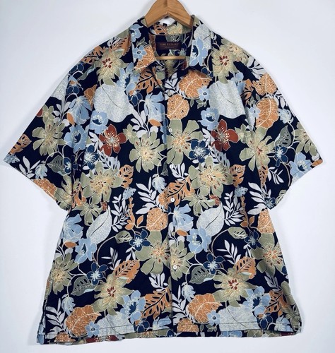 Navy blue Hawaiian shirt with orange, yellow, and white floral print, short sleeves, and button-up front.