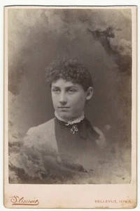 YOUNG WOMAN WITH HER HEAD IN THE CLOUDS IN BELLEVUE, IOWA - Picture 1 of 3