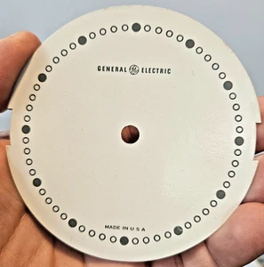 Reloj General Electric esfera hecho en EE. UU. cartón estaño 3 1/2" - Imagen 1 de 2