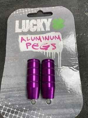 Clavijas de aluminio Lucky púrpura se adapta a la mayoría de las horquillas y cubiertas Foto 1 de 2