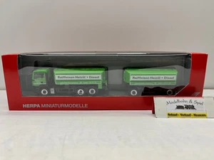Herpa 159739 Spur H0 1/87 MAN TGS M Benzintank-Hängerzug "Raiffeisen / RWZ" - Bild 1 von 3