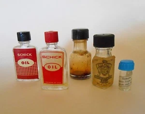 Reloj antiguo y afeitadora eléctrica 5 botellas de aceite de vidrio - Imagen 1 de 7