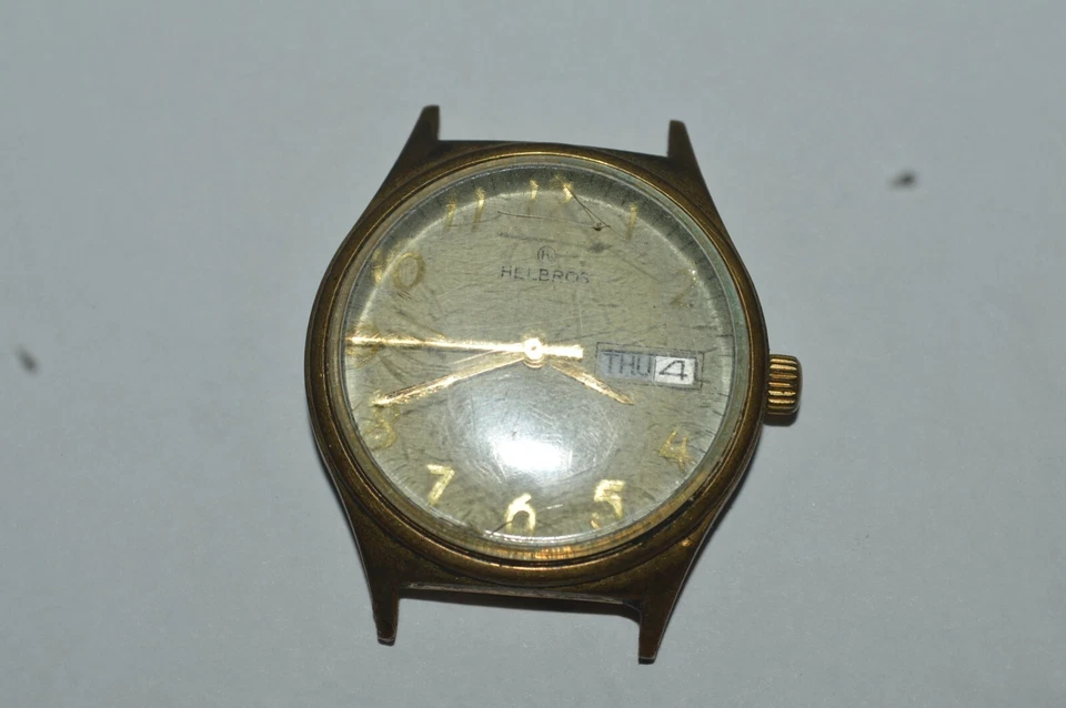Reloj de cuarzo HELBROS 481 34mm día y fecha números arábigos no funciona se vende como está Foto 1 de 4