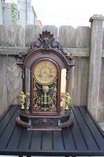 ansonia triumph walnut decorative parlor clock , w/cherubs , for restoration.