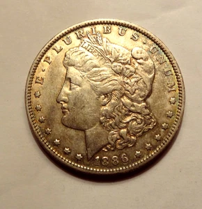1886 O MORGAN SILVER DOLLAR, XF-AU CONDITION - Picture 1 of 2
