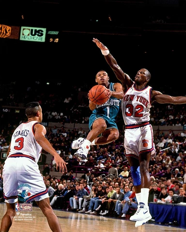 Muggsy Bogues Hornets Unsigned Teal Jersey Mid-Air vs New York Knicks Photo Cover