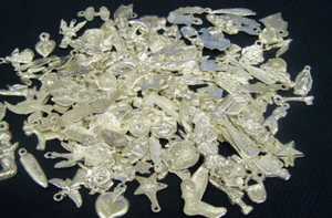 Milagro lot - 100 Assorted Silver Colored Silvery Mexican Milagros - Picture 1 of 1