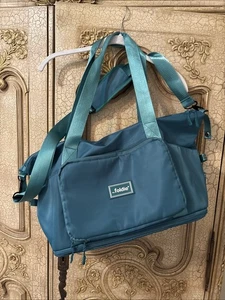 The Foldie Teal Travel Tote Bag Multi Pockets Foldable Crossbody Strap - Picture 1 of 9