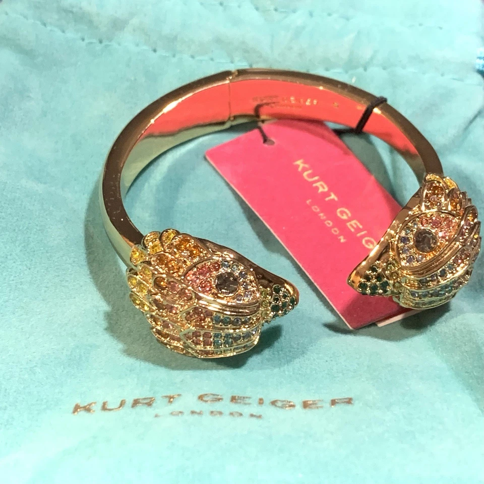 Brazalete de oro con bisagras cabeza de águila firma multi cristal Kurt Geiger London Foto 1 de 4
