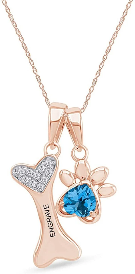 Colgante de topacio azul simulado con estampado de pata y hueso de perro en plata chapada en oro de 14 k Foto 1 de 4