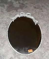 A vintage , round wall mirror Cover