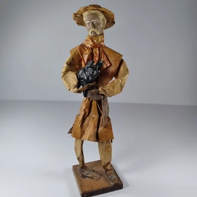 Escultura vintage de papel maché estilo popular mexicano, hombre sosteniendo cerdo Foto 1 de 4