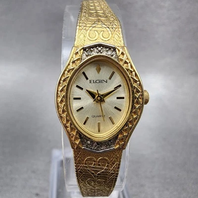 Reloj Elgin Mujer 18mm Esfera Champagne Tono Dorado Bisel Diamante Ovalado Batería Nueva Foto 1 de 4