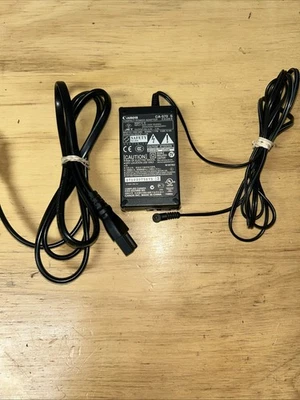 Auténtico adaptador de fuente de alimentación de CA original Canon CA-570 cable cargador videocámara Foto 1 de 4