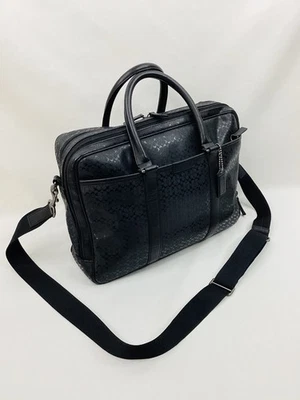 Bandolera de cercanías COACH para portátil Heritage Signature Series negra PVC en relieve Foto 1 de 4
