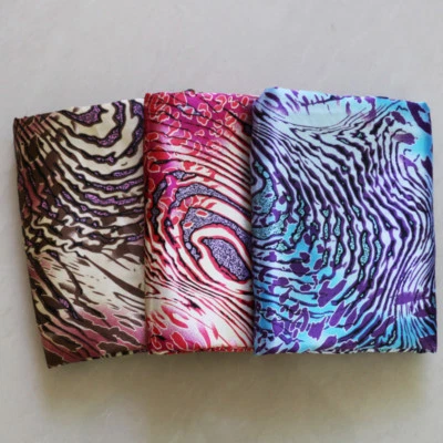 By Yard Soft Polyester Cahrmeuse African Patchwork Leopard Shirt Fabric Satin - Image 1 of 4