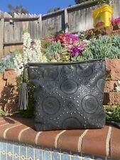 Sam & Hadley’s Geometric Punched Pattern And Studs On Black Faux Suede Bag