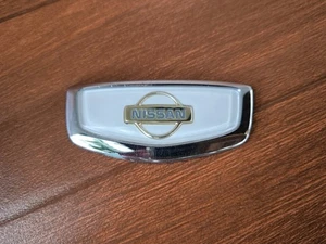Nissan CIMA Y33 FGY33 Rear Trunk Emblem Badge White 1996-2012 JDM OEM - Picture 1 of 18