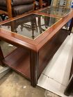 Brown Wooden Coffee Table With Glass Panels
