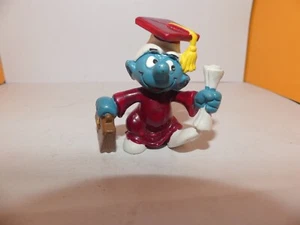 PEYO FIGURINE SCHTROUMPF DIPLOME ET SACOCHE VIOLET 1981 - Picture 1 of 3