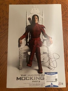 POSTER FILM AUTO HUNGER GAMES FIRMATO JENNIFER LAWRENCE 12X18 BECKETT BAS COA - Foto 1 di 2
