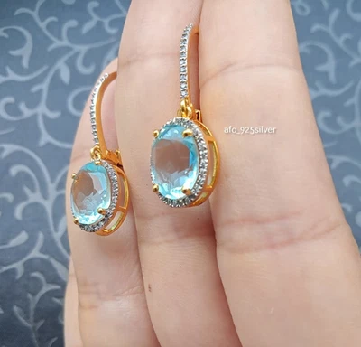 Preciosos aretes colgantes de aguamarina simulada de corte ovalado enchapados en oro amarillo de 14K Foto 1 de 4