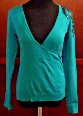 Suéter envolvente sintético verde Attention para mujer con detalle de lentejuelas con cuentas negras talla XS Foto 1 de 4