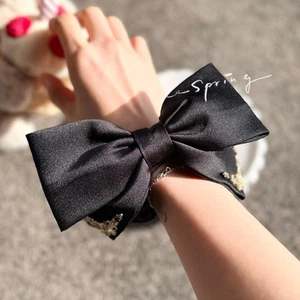 Black Satin Bow Scrunchie with Gold Accents – Elegant Pearl Trim Hair Tie - Foto 1 di 7