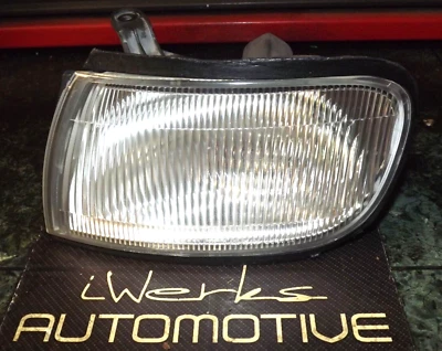 95-99 OEM Nissan Maxima front driver / left corner light assembly 120-63380 L V1 - Image 1 of 4