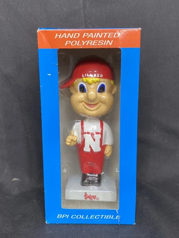 UNIV NEBRASKA CORNHUSKERS LIL REDMASCOT FOOTBALL NCAA BPI COLLECTIBLE BOBBLEHEAD Cover