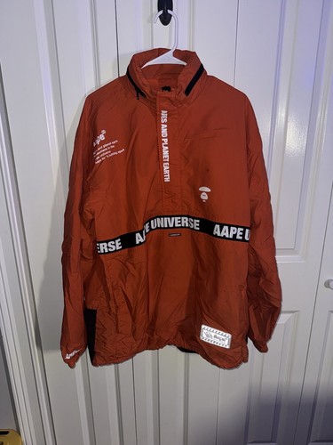 A BATHING APE (BAPE) Giacca con cappuccio A Bathing Ape Ape Rompivento ""Scimmie e pianeta terra"" arancione XL