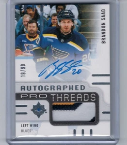 2024-25 Ultimate Collection Brandon Saad Autogramm Pro Threads Auto #'ed 19/99 - Bild 1 von 1