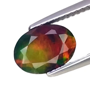 1.385CTS Regenbogen mehrfarbig blinkend schwarz natur opal ovale Form - Bild 1 von 2