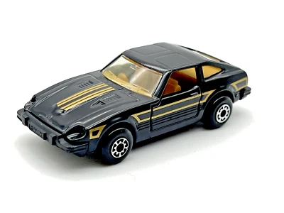 Matchbox MB67 1982 Datsun 280 ZX 2x2 negro con rayas doradas como nuevo en caja de PVC Foto 1 de 4