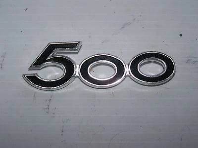  SUZUKI 68140-15001 EMBLEMA, CUBIERTA CUADRO LH T500 Foto 1 de 2