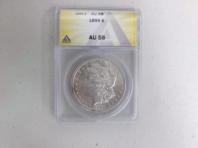 1899-P ANACS Morgan Silver Dollar - AU 58 - 1 oz. Coin  .90 Silver - USMA99P0 - Image 1 of 2