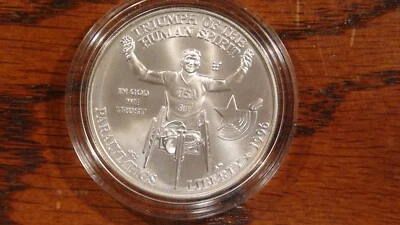 1996 D ATLANTA OLYMPICS WHEELCHAIR 1 OZ .999 SILVER COIN IN HARD CAPSULE! - Image 1 of 2