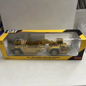 CAT 55175 1:50 Scale Caterpillar 657G Wheel Tractor Scraper Norscot BRAND NEW - Picture 1 of 4