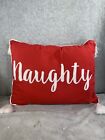 Christmas Throw Pillow With The Word Naughty With Pompom