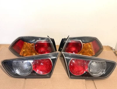 Juego de pares de luces de freno de luz trasera Mitsubishi Lancer 2008-2015 OEM usado Foto 1 de 4