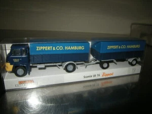 1:87 H0 Brekina Scania LB 76 cremallera con remolque en embalaje original - Imagen 1 de 1