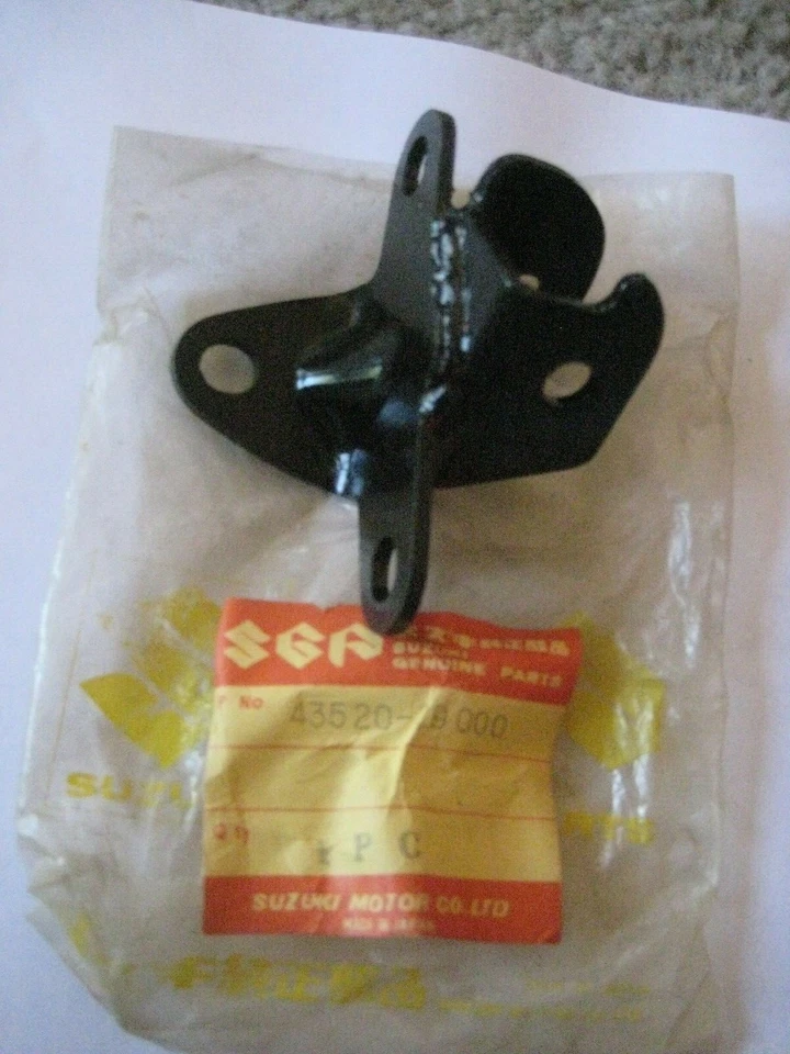 SOPORTE REPOSAPIÉS IZQUIERDO SUZUKI TS185 SIERRA/TC185 RANGER ¡NUEVO! Foto 1 de 1