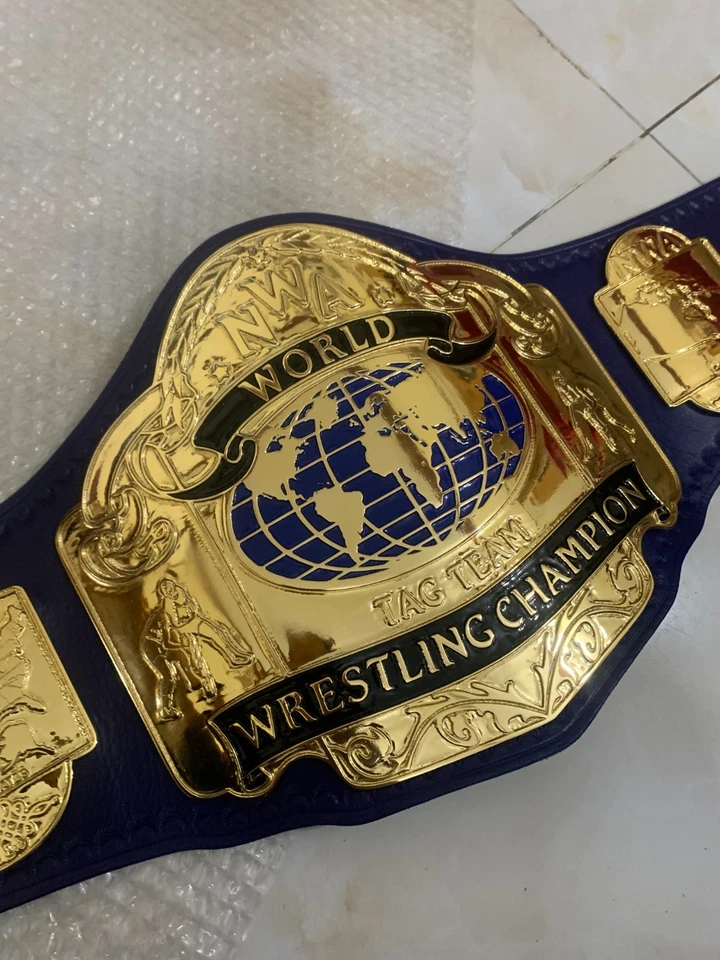 Cinturón de campeonato de lucha libre NWA World Tag Team, 4 mm zinc, chapado en oro, cuero real Foto 1 de 4
