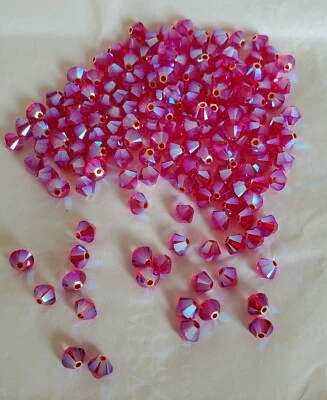 Swarovski 5328 4mm bicone beads, Light Siam AB2X (24pcs) - Image 1 of 3