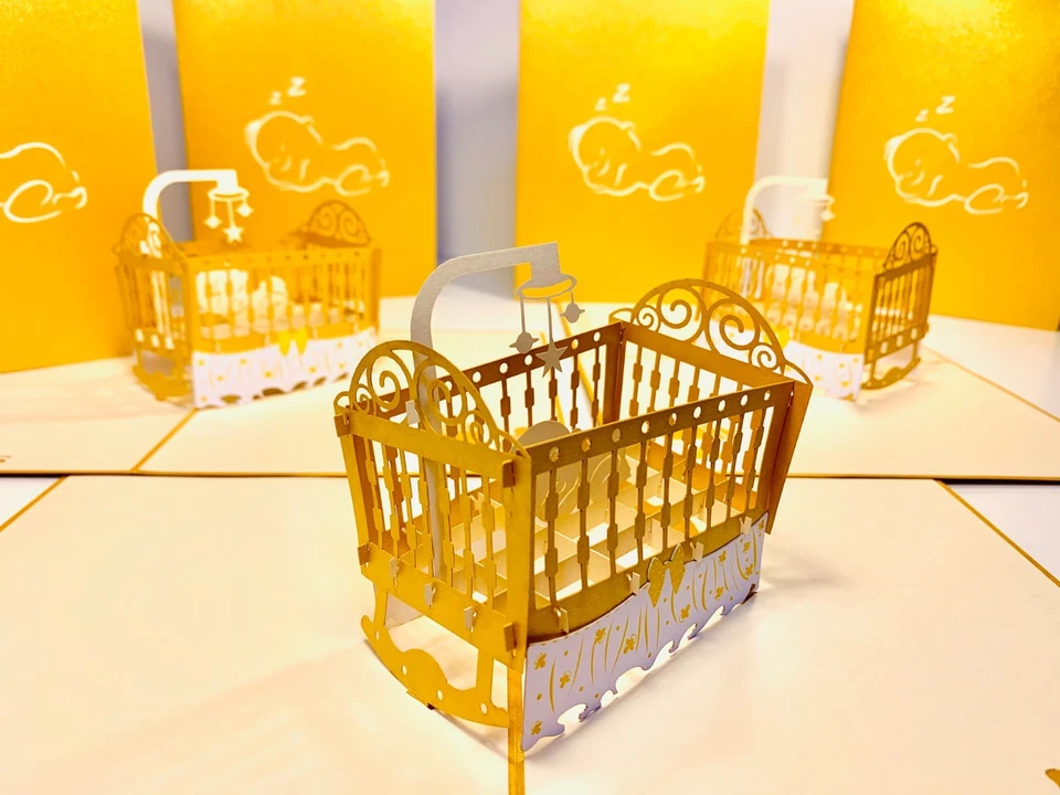 Tarjetas Pop Origami Cuna Metálica en Dorado Bebé Recién Nacido 3D Tarjeta Pop Up Foto 1 de 4
