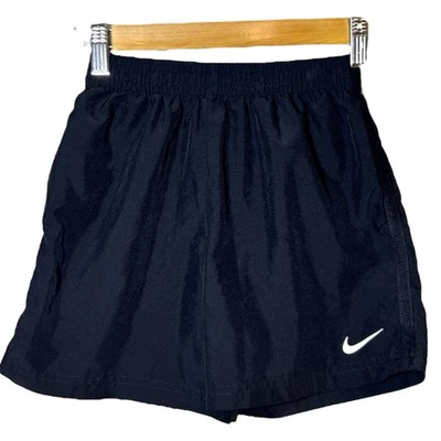 Pantalones cortos deportivos Nike cortavientos de nailon negros talla mediana 5-6 años Foto 1 de 4